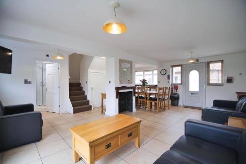 a living room with a couch and a table at Murton Grange in York
