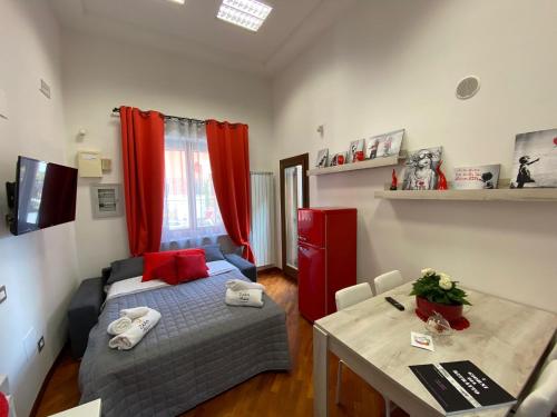 a small room with a bed and a table at Zara Palace in Scafati