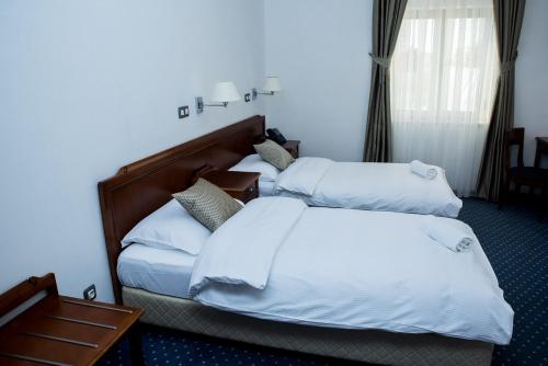 Una cama o camas en una habitación de Hotel Hum
