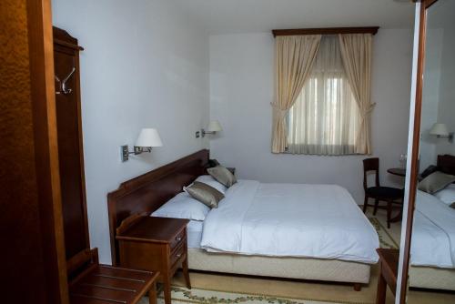 Una cama o camas en una habitación de Hotel Hum