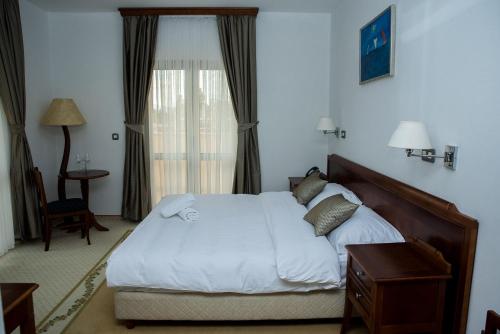 Una cama o camas en una habitación de Hotel Hum