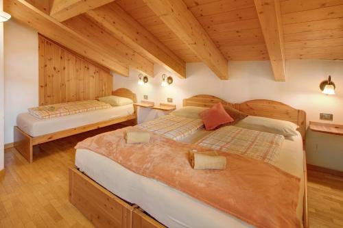 Ліжко або ліжка в номері Chalet La Marinella Stella Alpina