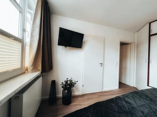 TV a/nebo společenská místnost v ubytování Lieblingsapartment No.12 für bis zu 6 Gäste