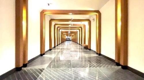 a hallway of a building with a long corridor at Quy Nhon Chillin' Apartment - FLC Sea Tower Quy Nhơn Căn Hộ Hướng Biển in Quy Nhon