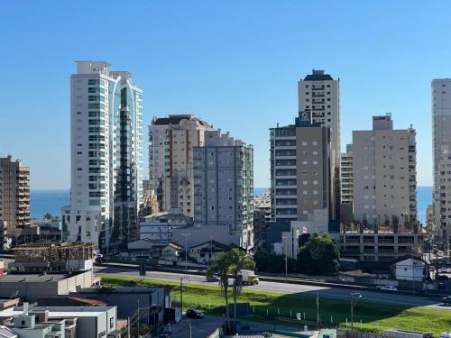 a view of a city with tall buildings at Apartamento Novo e Confortável in Itapema