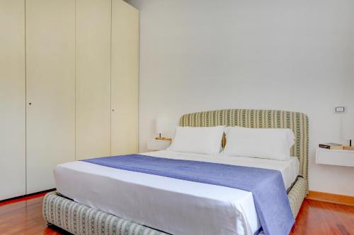 Postel nebo postele na pokoji v ubytování Colosseo Green Park - Home and More