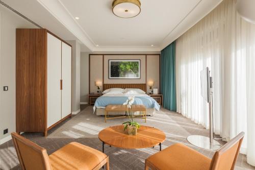 a hotel room with a bed and a table at Vincci Porto in Porto