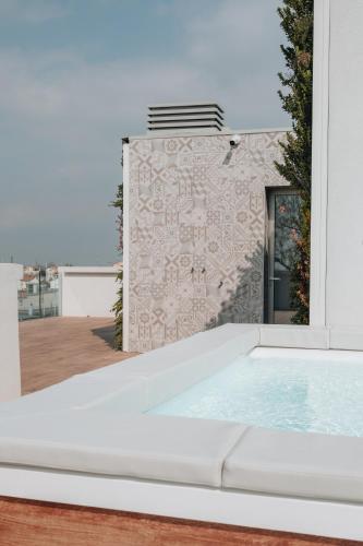 a swimming pool in front of a building at Sea Breeze in Caorle