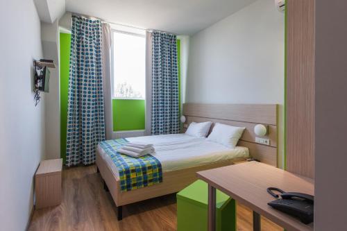 מיטה או מיטות בחדר ב-Hotel Marenero