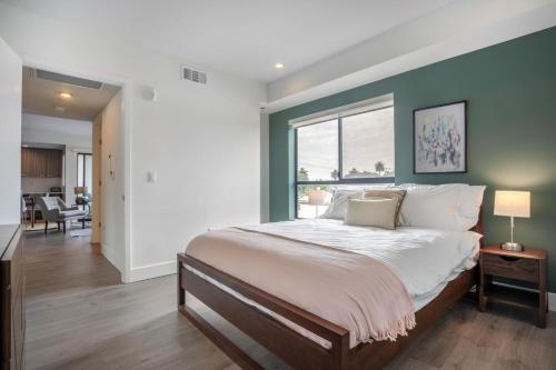 a bedroom with a large bed with a large window at Mar Vista 1BR w in-unit WD Gym nr Venice Beach LAX-136 in Los Angeles