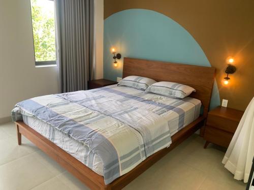 Een bed of bedden in een kamer bij TP-HOMES