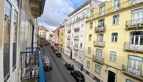 a view of a city street with buildings at House On The Hill Lisbon in Lisbon