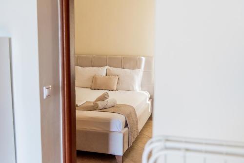 a bedroom with a bed with a stuffed animal on it at Villa Cavo d' Oro in Korissia