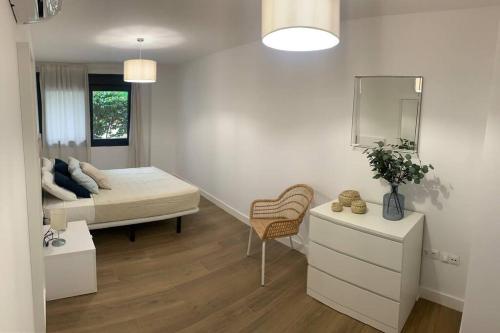 Posteľ alebo postele v izbe v ubytovaní Apartamento Central E