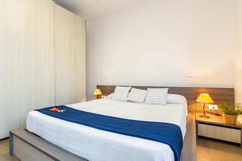 Ліжко або ліжка в номері Regina del Salento