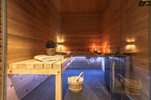 a sauna with a bench in a wooden room at AR Prestige Penthouse - TriBeCa Loft in Bergamo