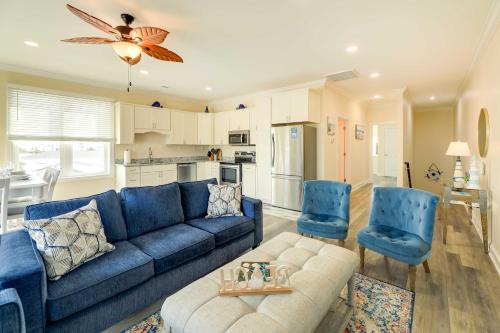 a living room with a blue couch and blue chairs at Emerald Isle Vacation Home Walk to Beach! in Emerald Isle