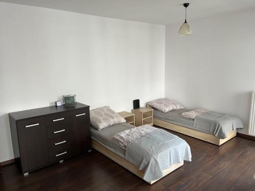Postel nebo postele na pokoji v ubytování Tylna 8 Apartments