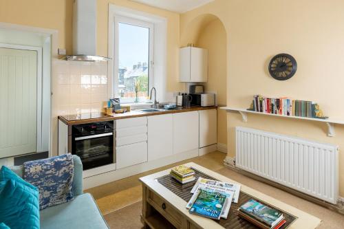 a kitchen with a coffee table in a room at Ilkley Studio in Ilkley