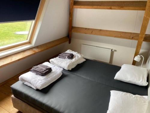Katil atau katil-katil dalam bilik di Ballumerhoeve Fleuri lodge