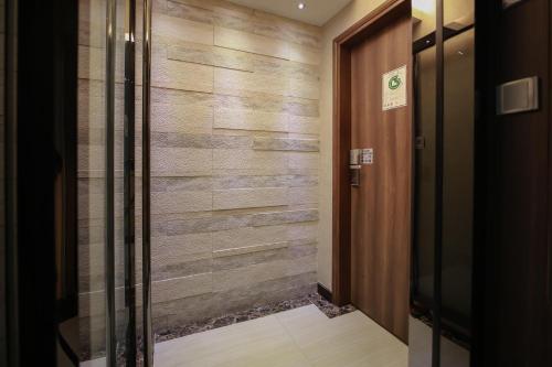 a hallway with a wooden wall at Hygge House in Hong Kong