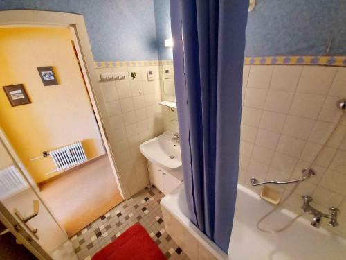 a small bathroom with a shower and a toilet at Apartments in Bad Mitterndorf - Steiermark 41117 in Bad Mitterndorf