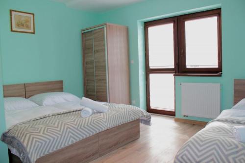 Ένα ή περισσότερα κρεβάτια σε δωμάτιο στο Villa TATRIA
