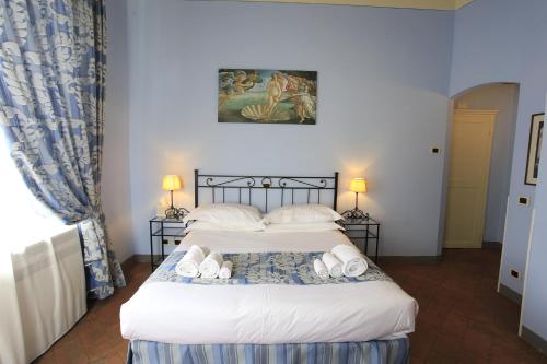 Postel nebo postele na pokoji v ubytování Palazzo Mari