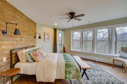 a bedroom with a bed and a ceiling fan at Modern Nellysford Getaway on 40 Private Acres! in Wintergreen