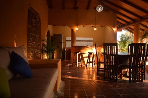 a living room with a couch and a table at Casa del Mar by Playa Larga in Agua de Correa