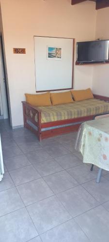 a large bed in a room with at Cuty Nakey in Puerto Madryn