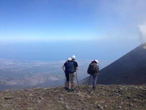 two people standing on top of a mountain at Etna Casa del Sole in Nicolosi