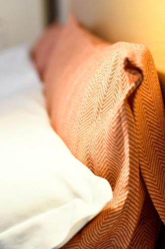 a close up of a pillow on a bed at Camere D'artista in Enna