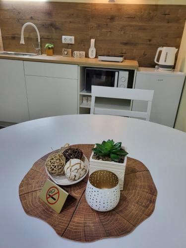 a table with a plate of food in a kitchen at Дунав Билдингс 2 in Pleven