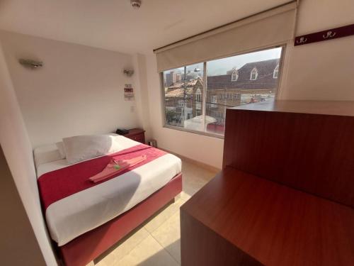 Postel nebo postele na pokoji v ubytování Hotel Cabrera Real