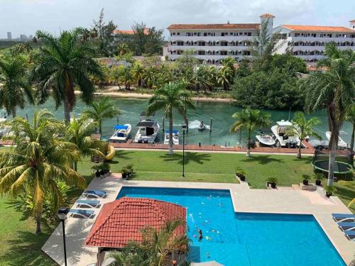 an aerial view of a resort with a swimming pool at CHIC Lagoon front Villa by Casa Paraíso in Cancún
