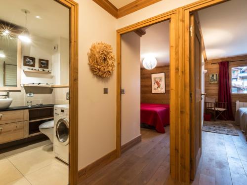a bathroom with a washer and dryer in a room at Appartement Val-d'Isère, 4 pièces, 8 personnes - FR-1-694-307 in Val-d'Isère