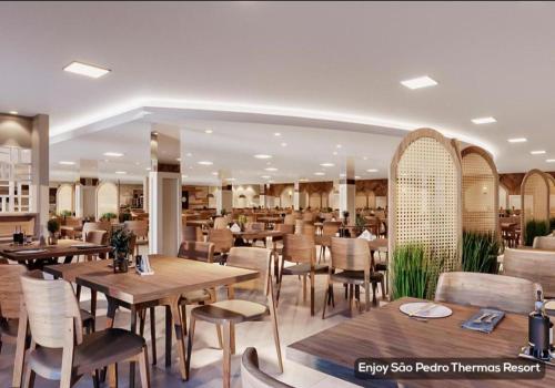 rendering restauracji ze stołami i krzesłami w obiekcie São Pedro Thermas Resort Parque w mieście Águas de São Pedro