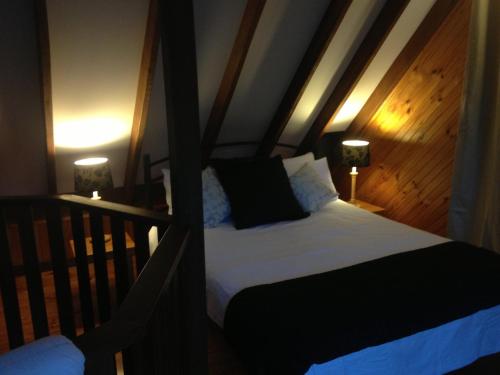 a bedroom with a bed and a lamp at Beyonderup Falls Adult Retreat in Nannup