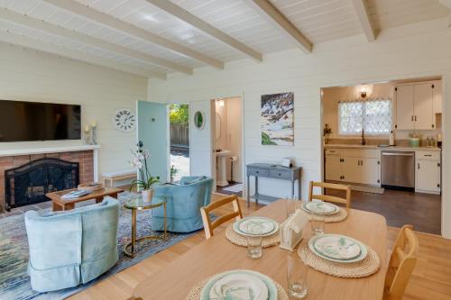 a dining room and living room with a table and chairs at Vacation Rental Home about 1 Mi to Carmel Beach! in Carmel