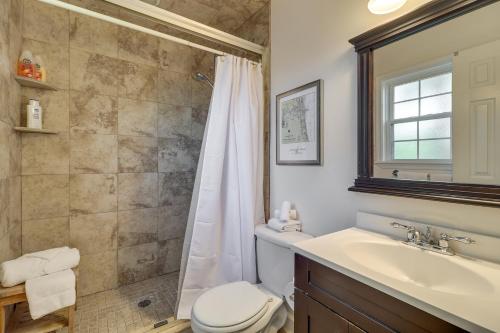 a bathroom with a shower and a toilet and a sink at Beach Retreat in Jacksonville Pet and Family-Friendly in Jacksonville Beach