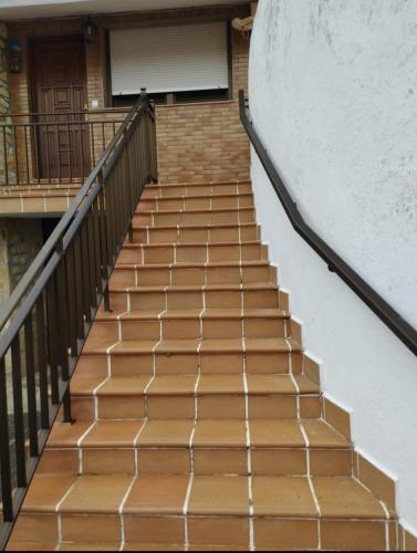 a set of stairs leading up to a building at Apartamentos Joaquina in Tagle