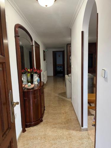 a hallway with a large mirror and a hallway with a hallwayngth at Apartamentos Joaquina in Tagle