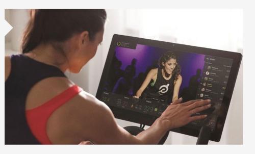 a woman typing on a computer monitor with a video at Kimpton Gray Hotel Chicago, an IHG Hotel in Chicago