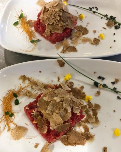 two plates of food sitting on a table at Madonna della Neve in Cessole