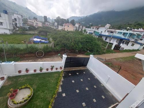 a view from the roof of a building at Kodai Diva Inn - Home Stay in Kodaikānāl