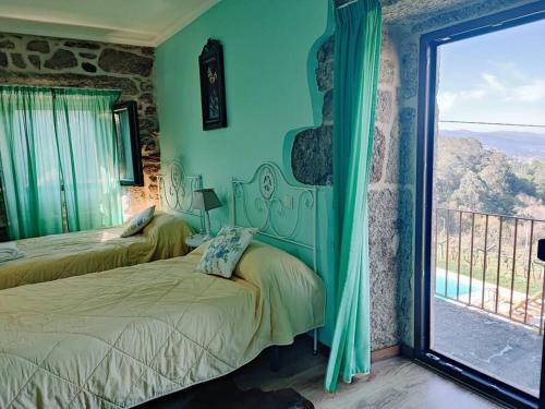 Letto o letti in una camera di Casa Cabreiros de Baixo