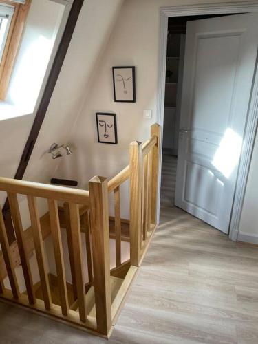 a room with a wooden staircase and a door at Le Trésor 4 pers à 20 minutes de Beauval in Montrichard