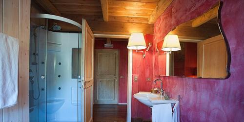 a bathroom with a sink and a mirror at L'Isola Di Rosa - Relais & Hotel di Charme in Cerveteri