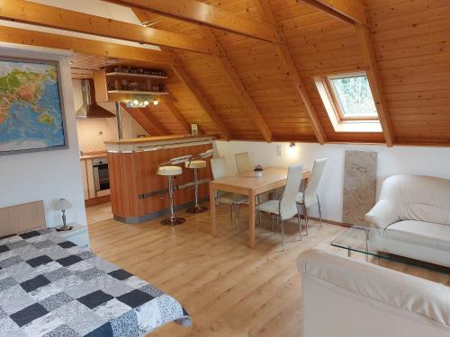 a living room with a table and a couch at Ferienwohnung zur Saaleaue in Wettin